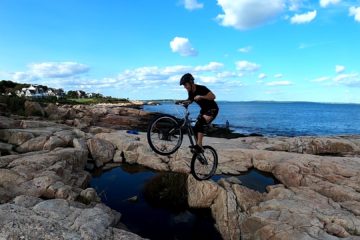 Mike Steidley prepares to gap across the water on his trials bike