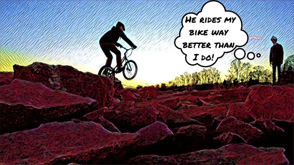 Joe prepares to hop off a boulder on Tim's trial bike