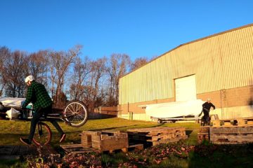 Tim bails off an obstacle, nearly landing on his stem