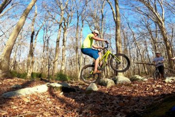 Ryan hops across some rocks on his trials bike