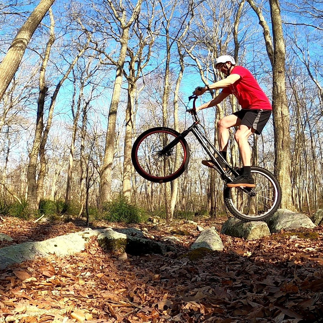 Tim prepares to hop off a rock on his trials bike