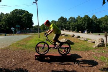 Balancing a bike on a picnic table seat