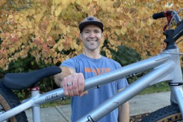 Travis Gardner holds out his Inspired Hex trials bike