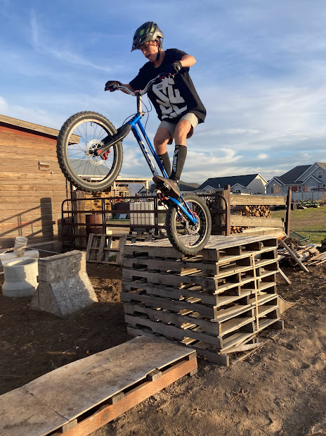 Rear wheel drop on a trials bike from a tall stack of pallets