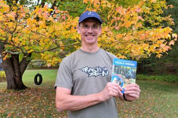 Tim holding the book Your Complete Guide To Trials Riding - Street Trials Augmented Edition, by Julien Happich